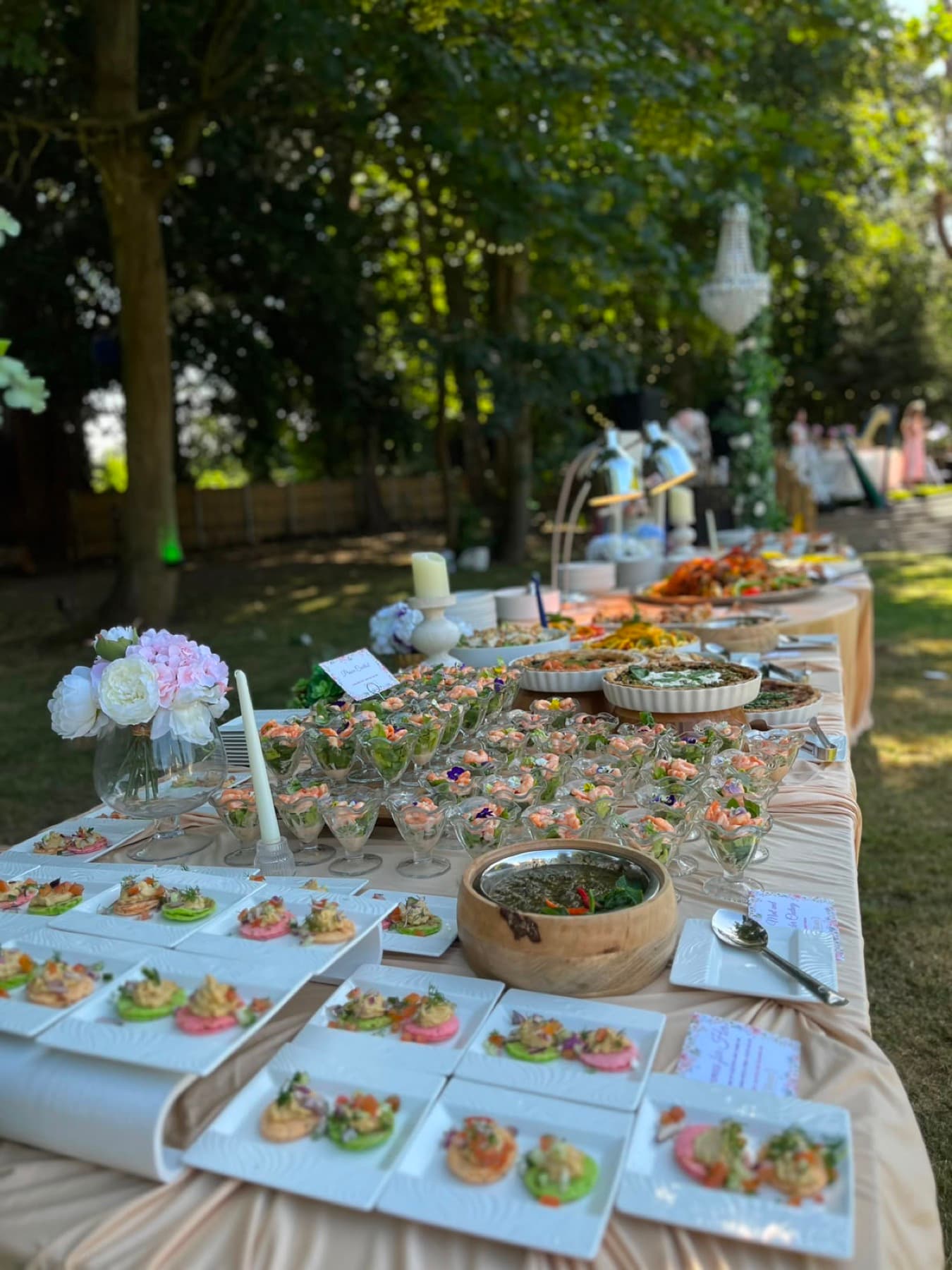 An elegant outdoor canapé spread catered by Blotts