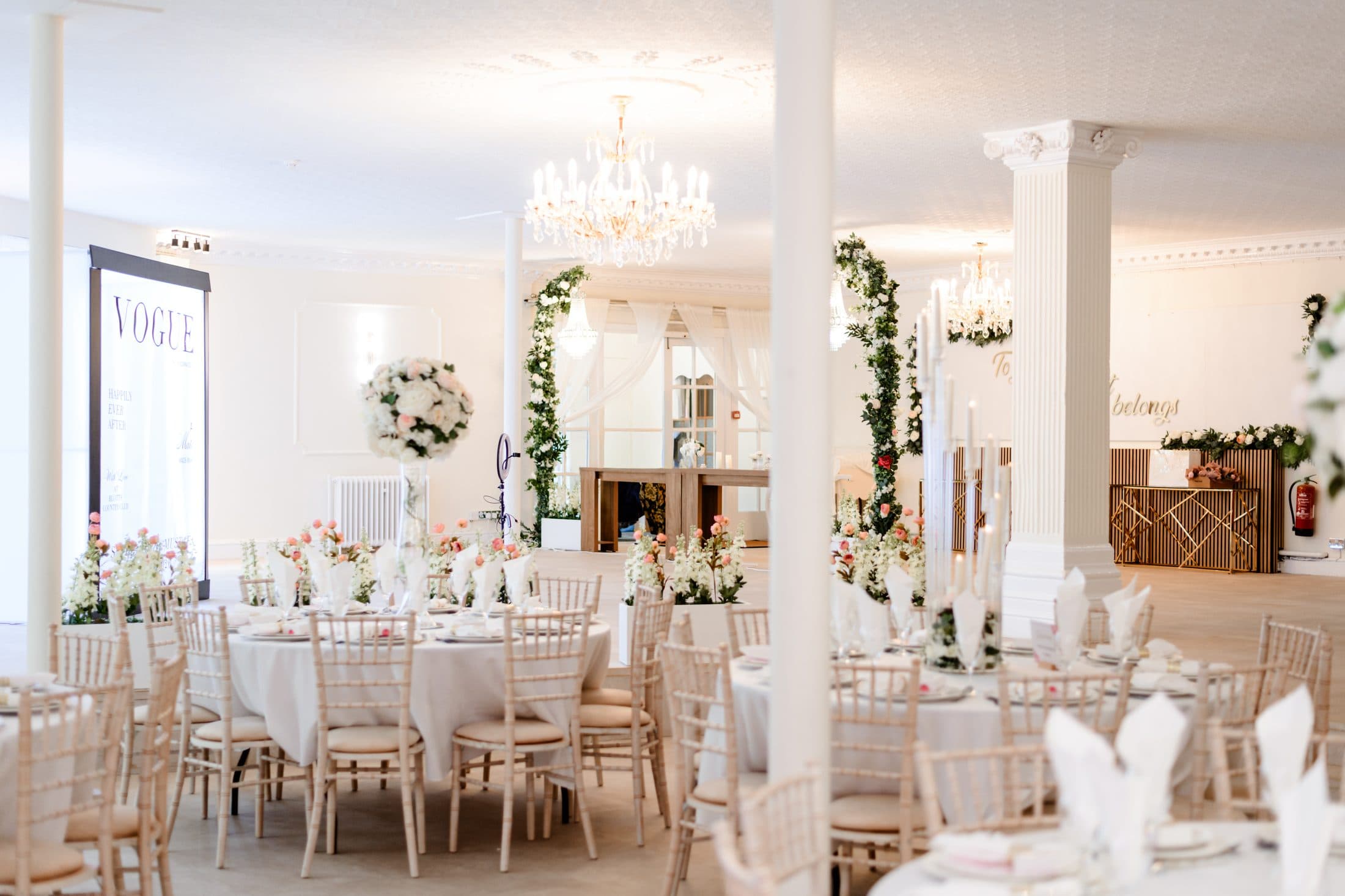 The Crystal Room in daylight, laid for a wedding breakfast
