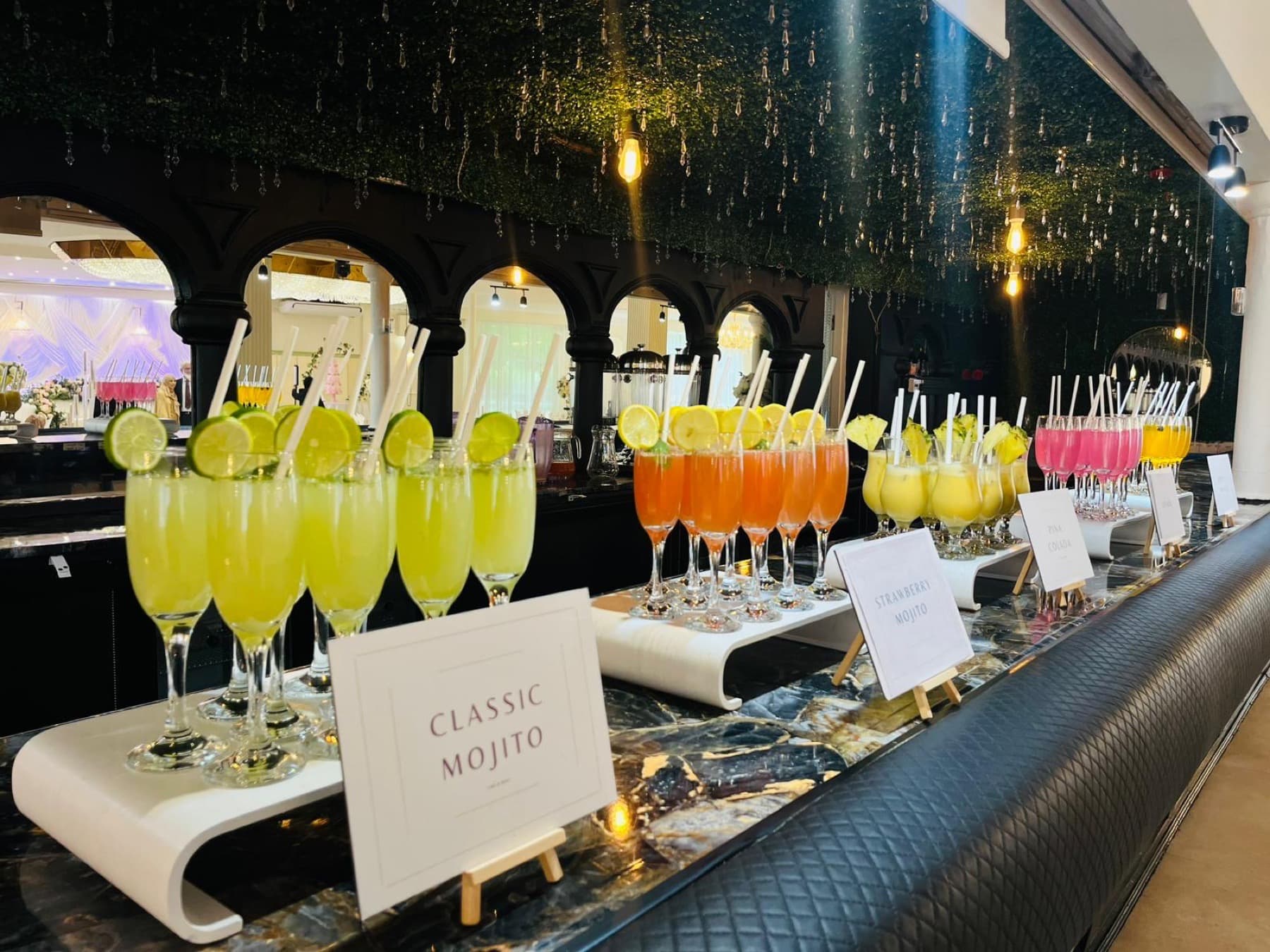 A line-up of named mocktails — Classic Mojito, Strawberry Mojito, Pina Colada — at the temperance bar